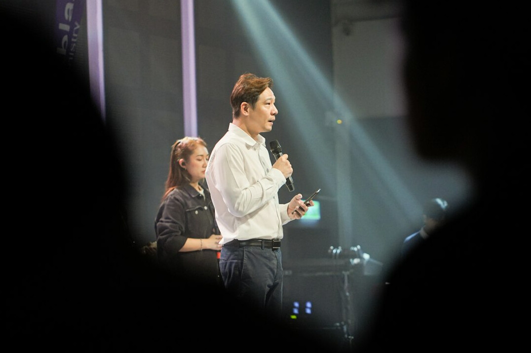 person speaking confidently on stage