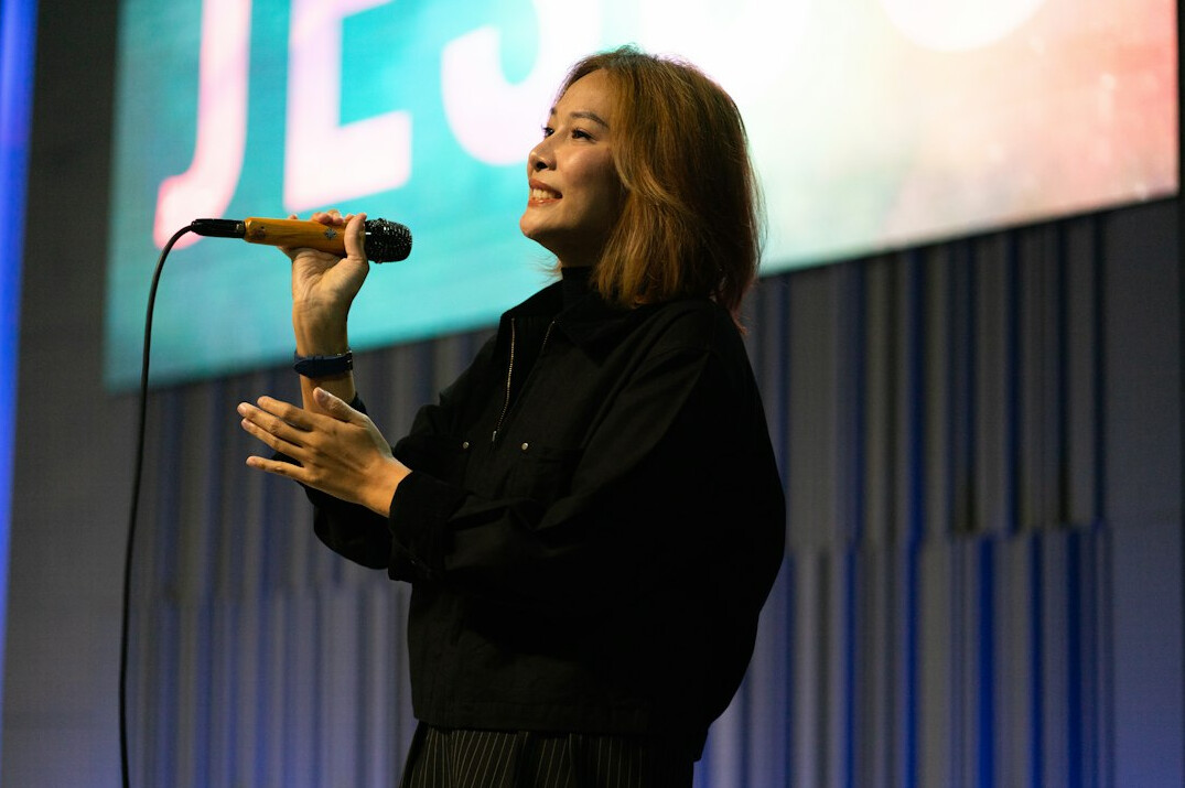 person speaking confidently on stage