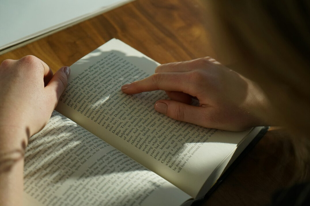 person reading self help book