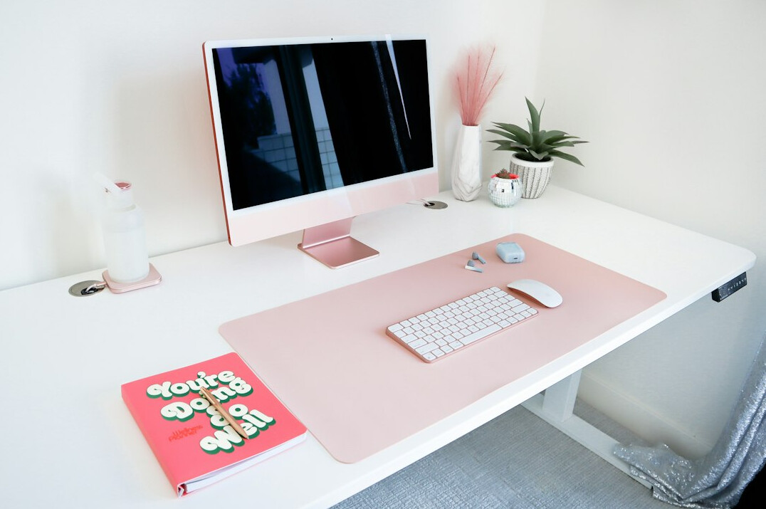 Bright minimal workspace with a desk and notebook