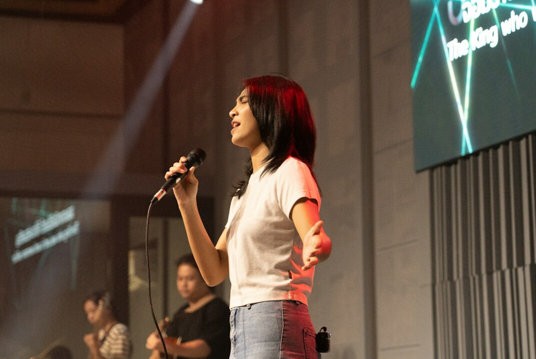 person speaking confidently on stage